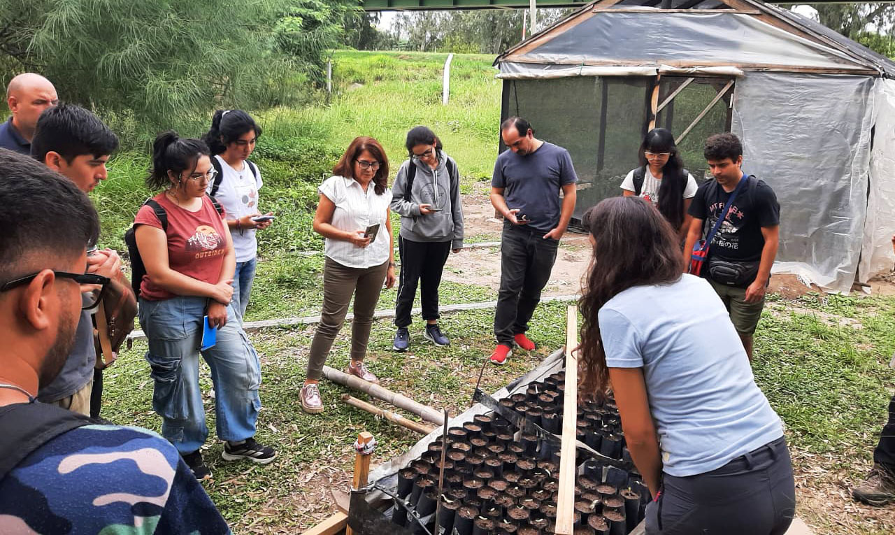 People standing outdoors during community training.