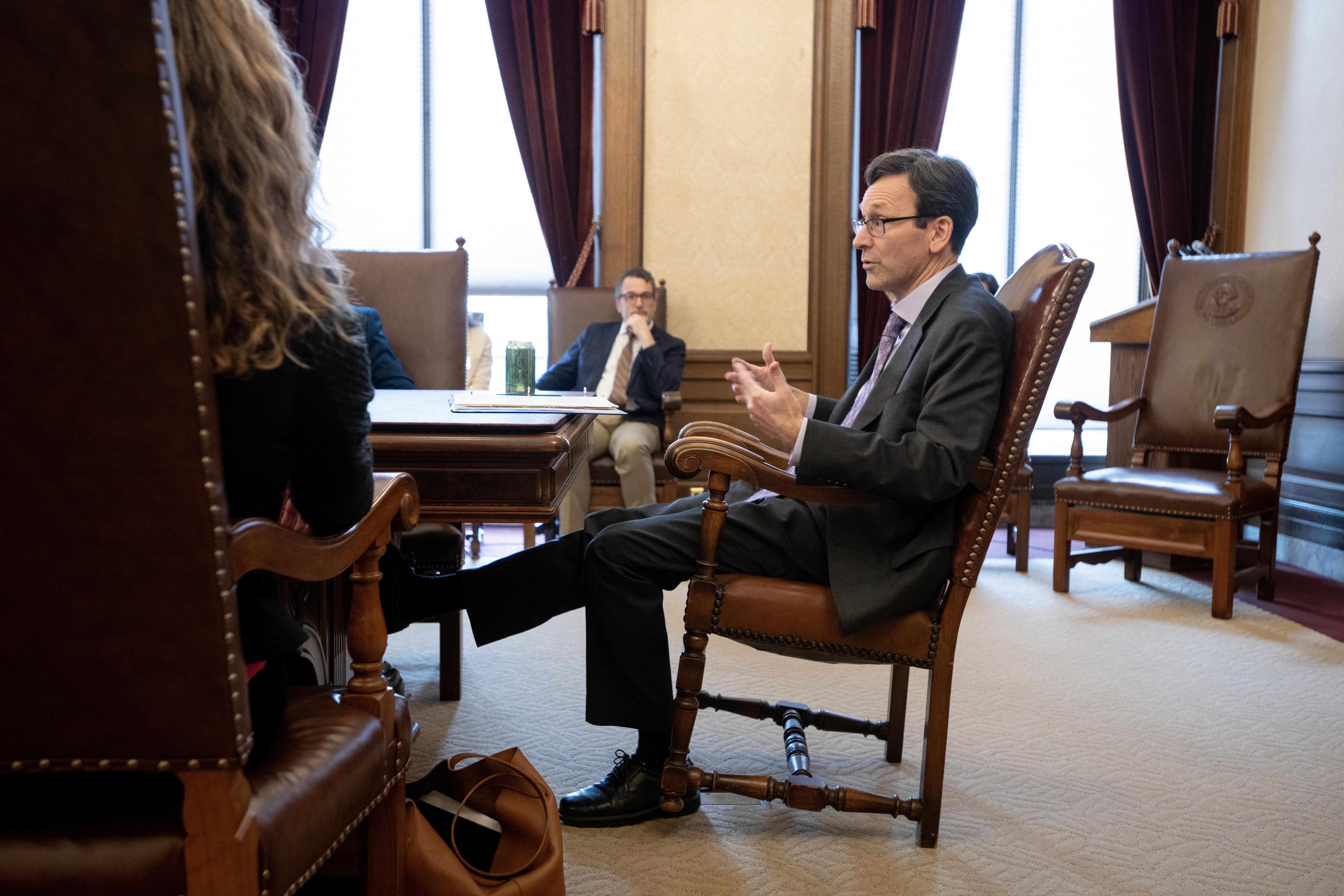 People sitting at a table for a meeting. 