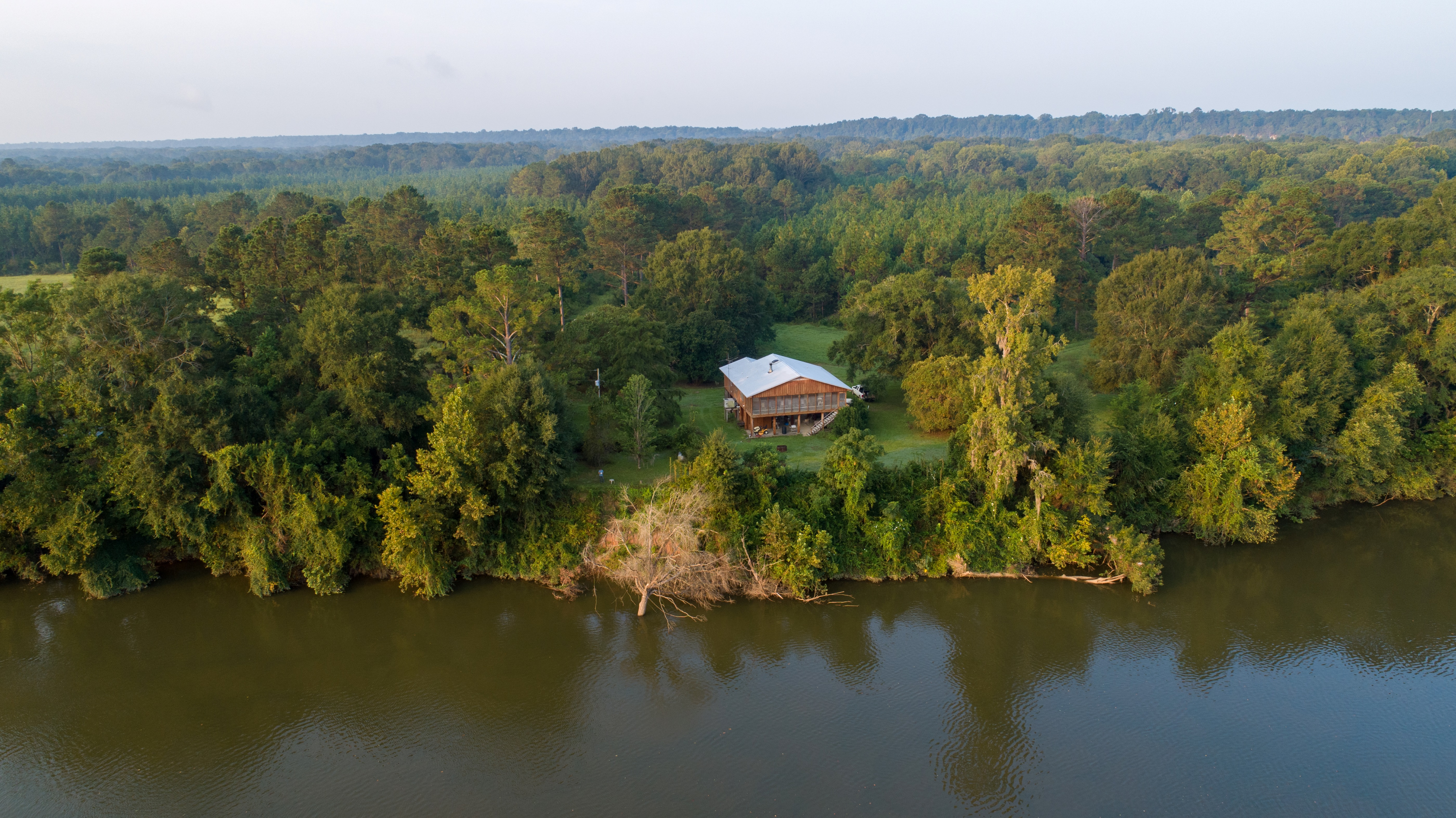 A home sits on the shores of the Alabama River.