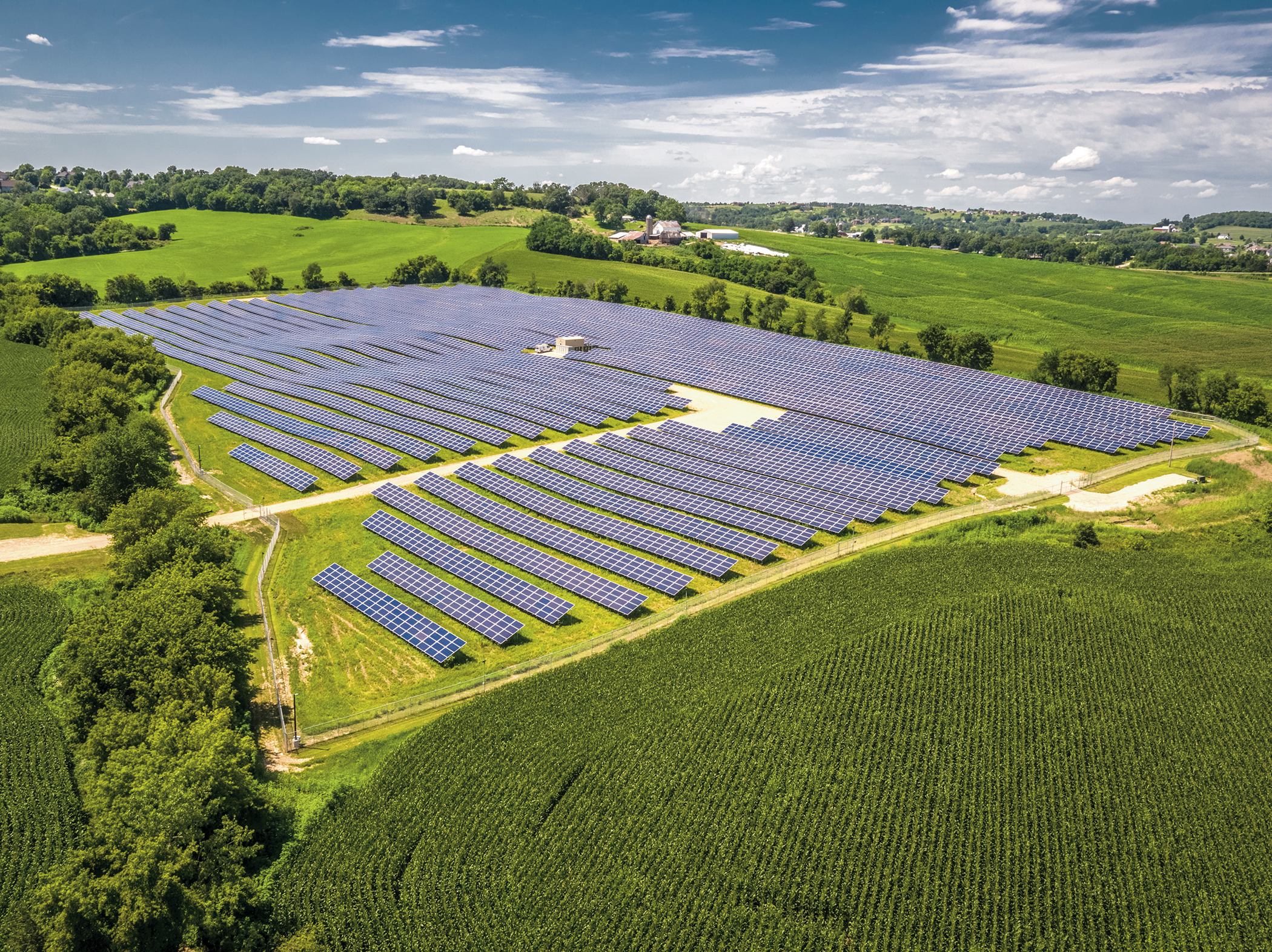Photo of a solar energy facility between Wisconsin farm fields.