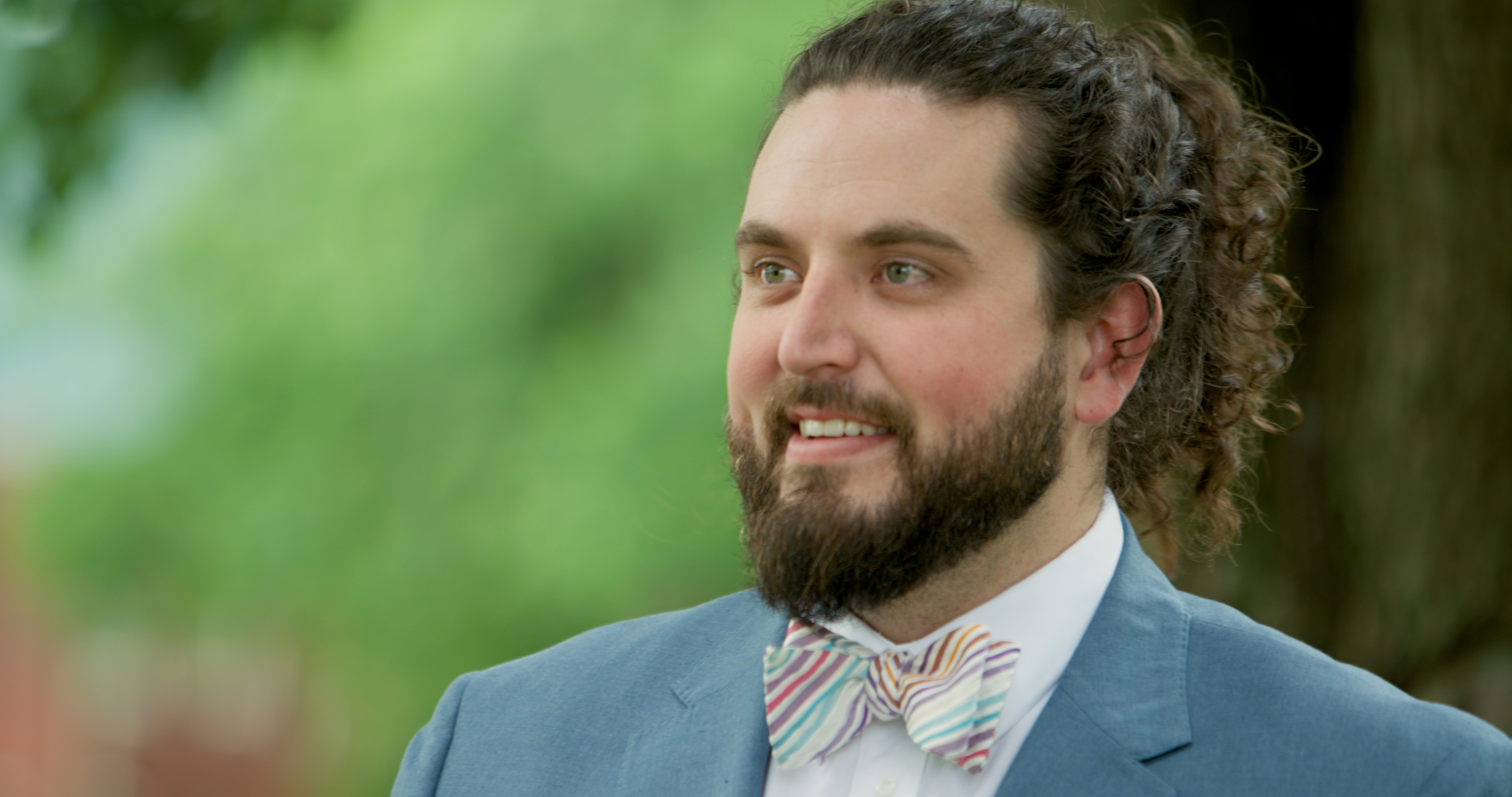 A photo of Boone Bowling, a smiling man with a beard and a bowtie.