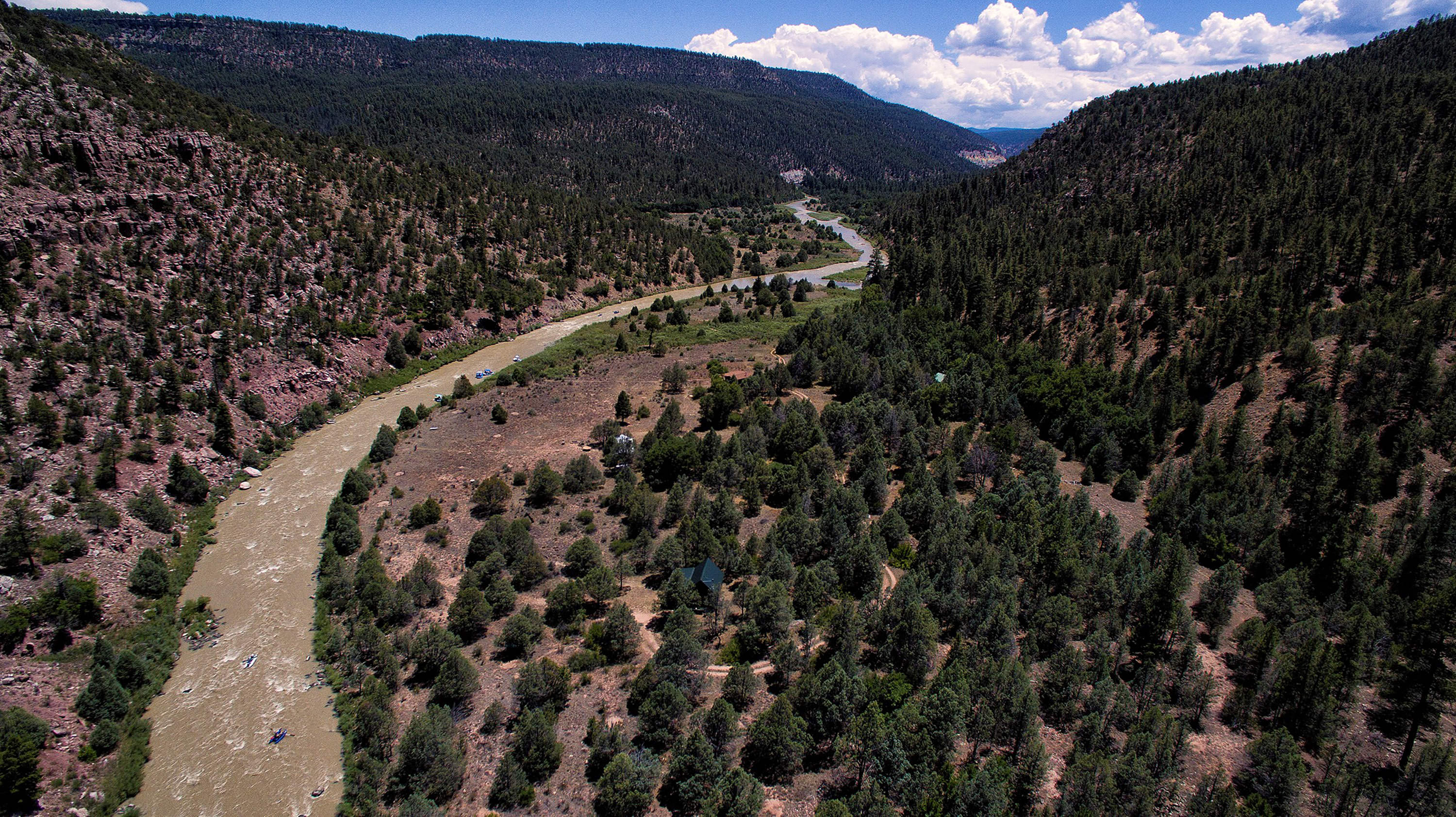 Photo of a sweeping view of Rio Chama river between mountains in New Mexico.