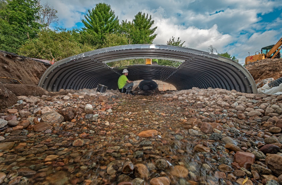 A person under a culvert.