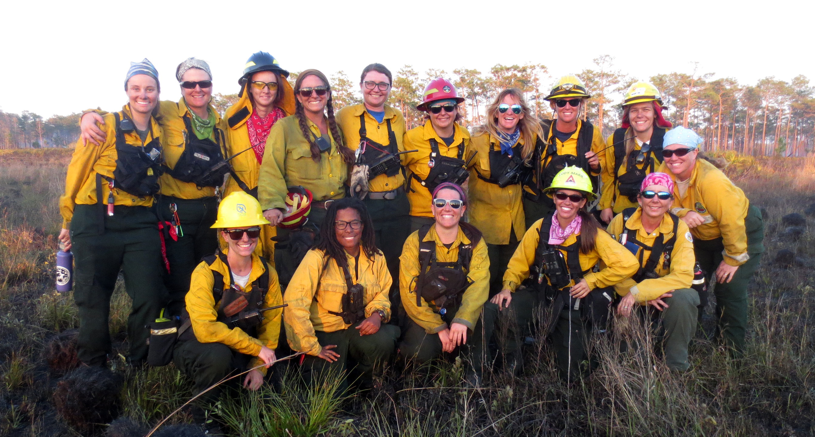 A group photo of 14 female fire-workers at an all-female controlled burn in Florida.