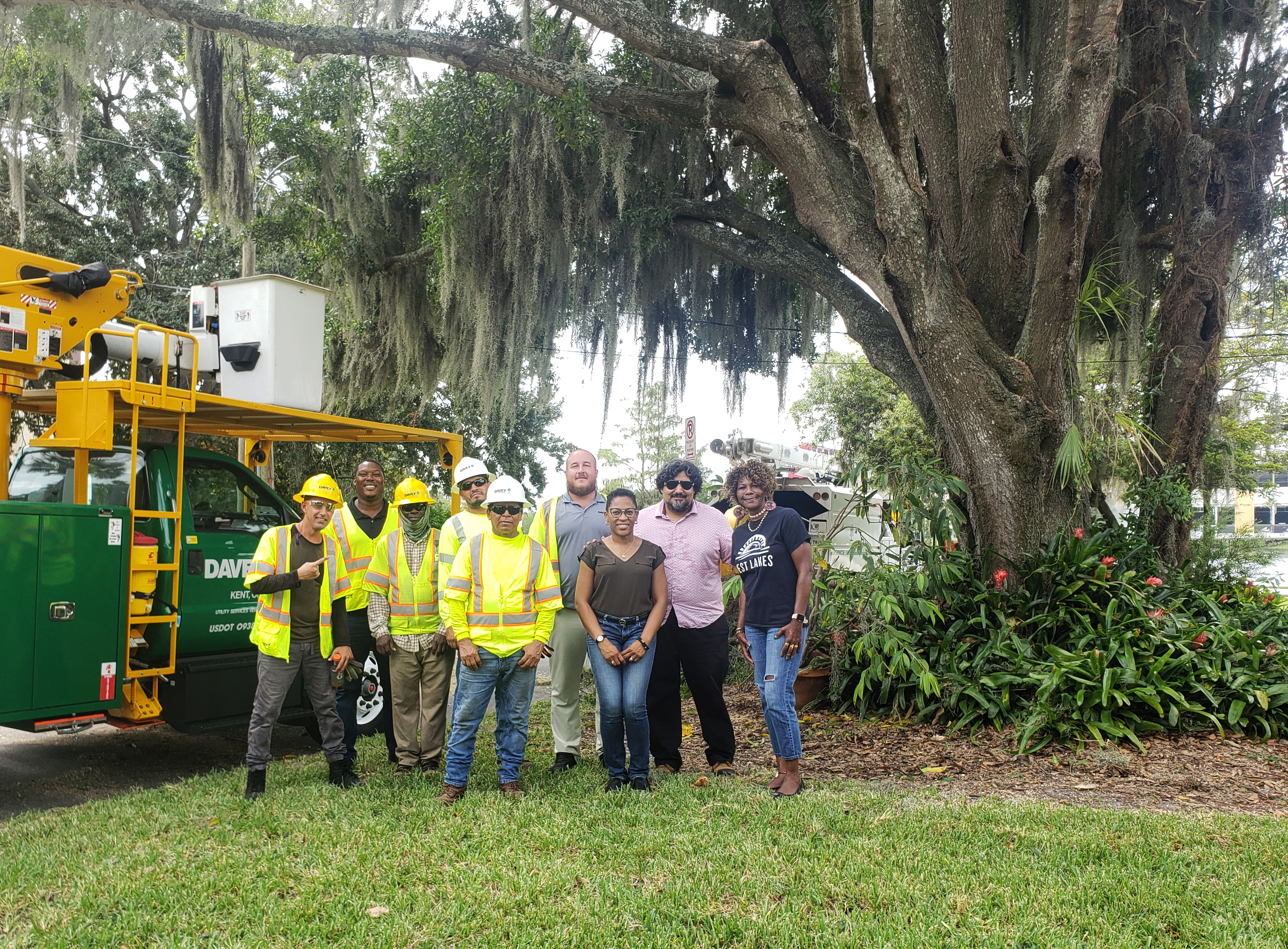 TNC and partners stand next to a tree pruning truck in Orlando, Florida.