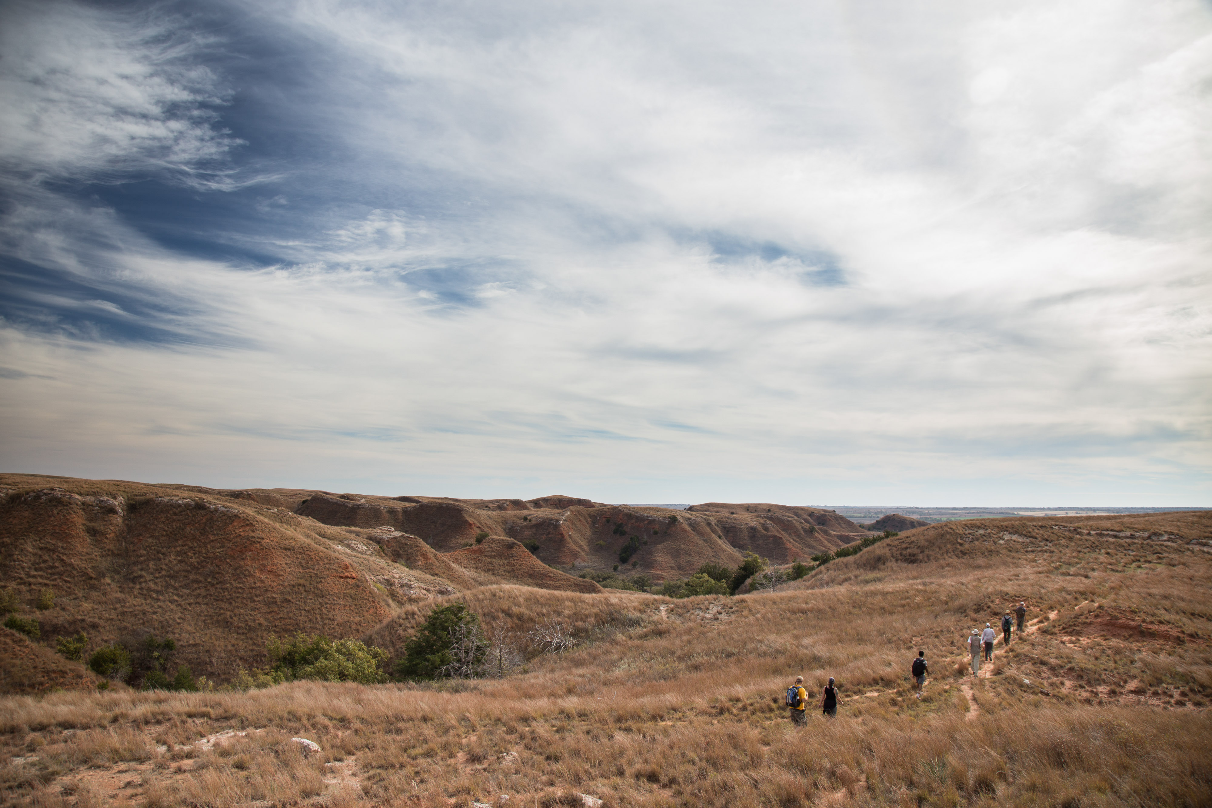 Hikers traversing over the canyon.