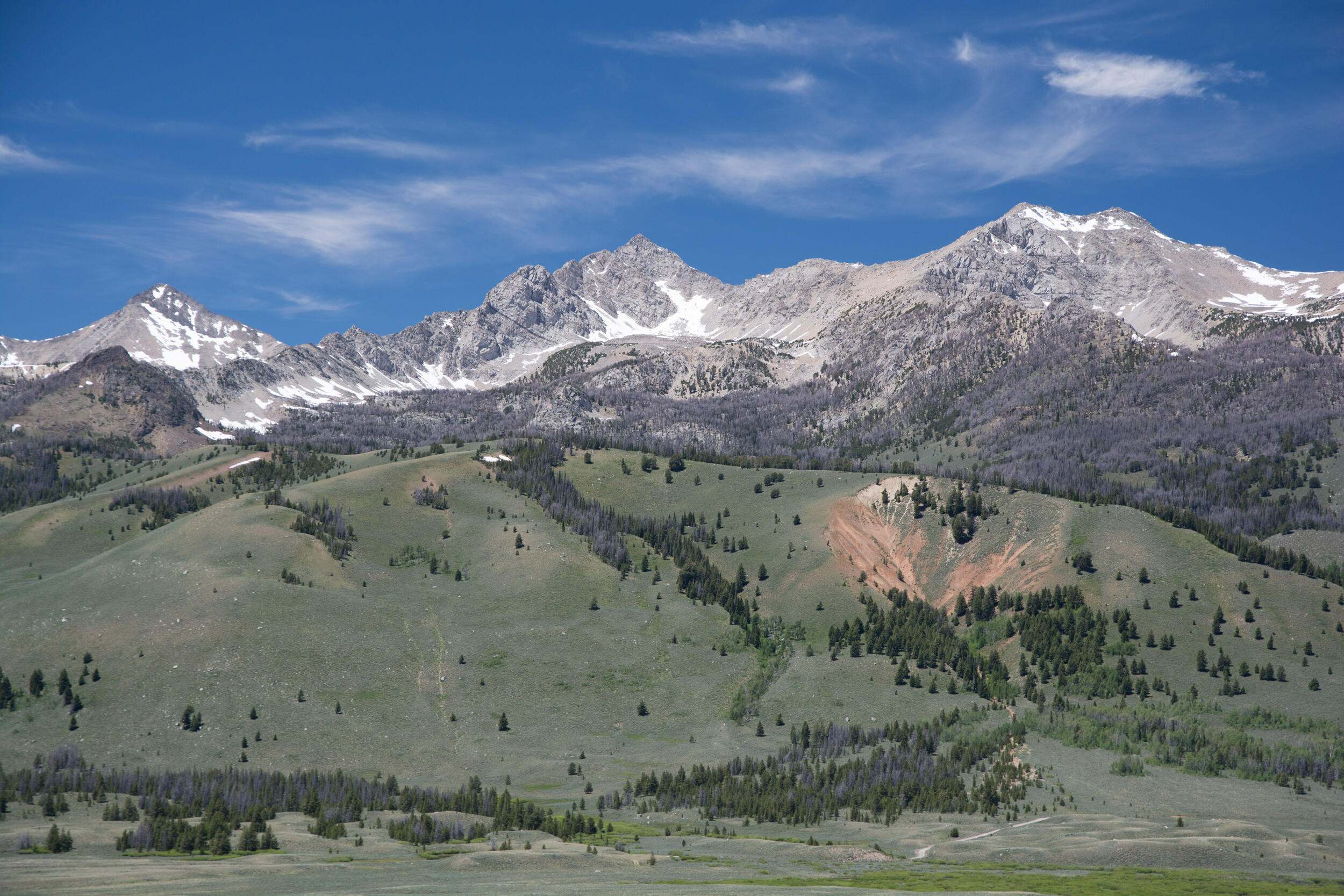 Rugged mountains topped with snow. 