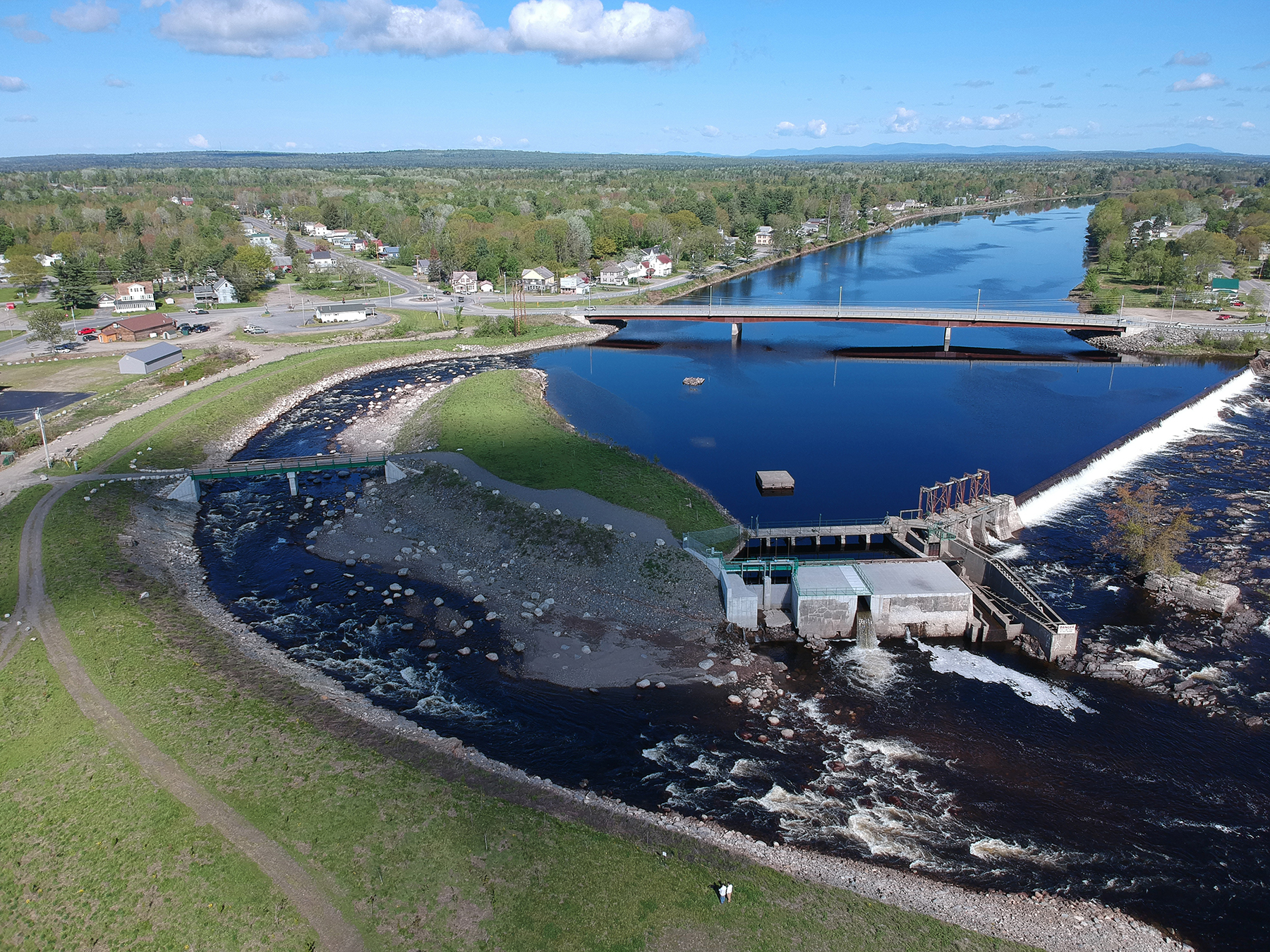 An aerial view of the bypass channel at a dam.