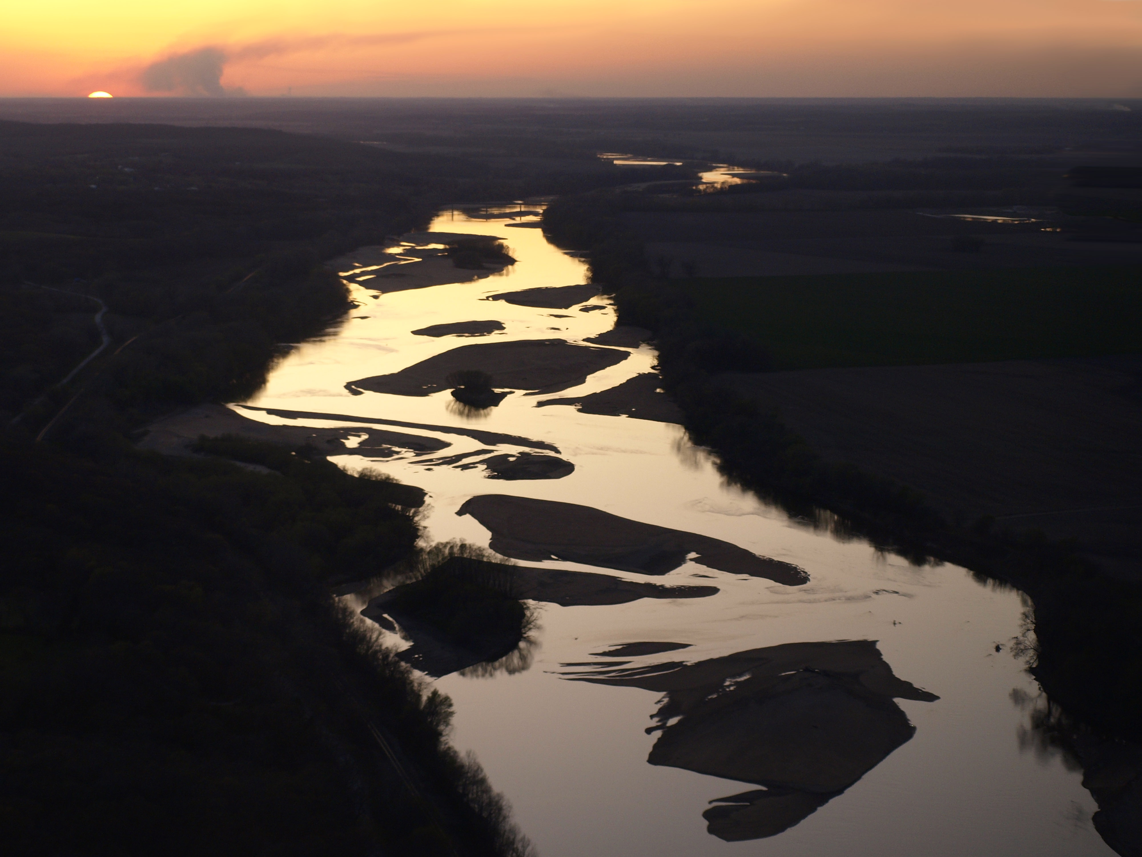 Aerial view of winding river with many sandbars.