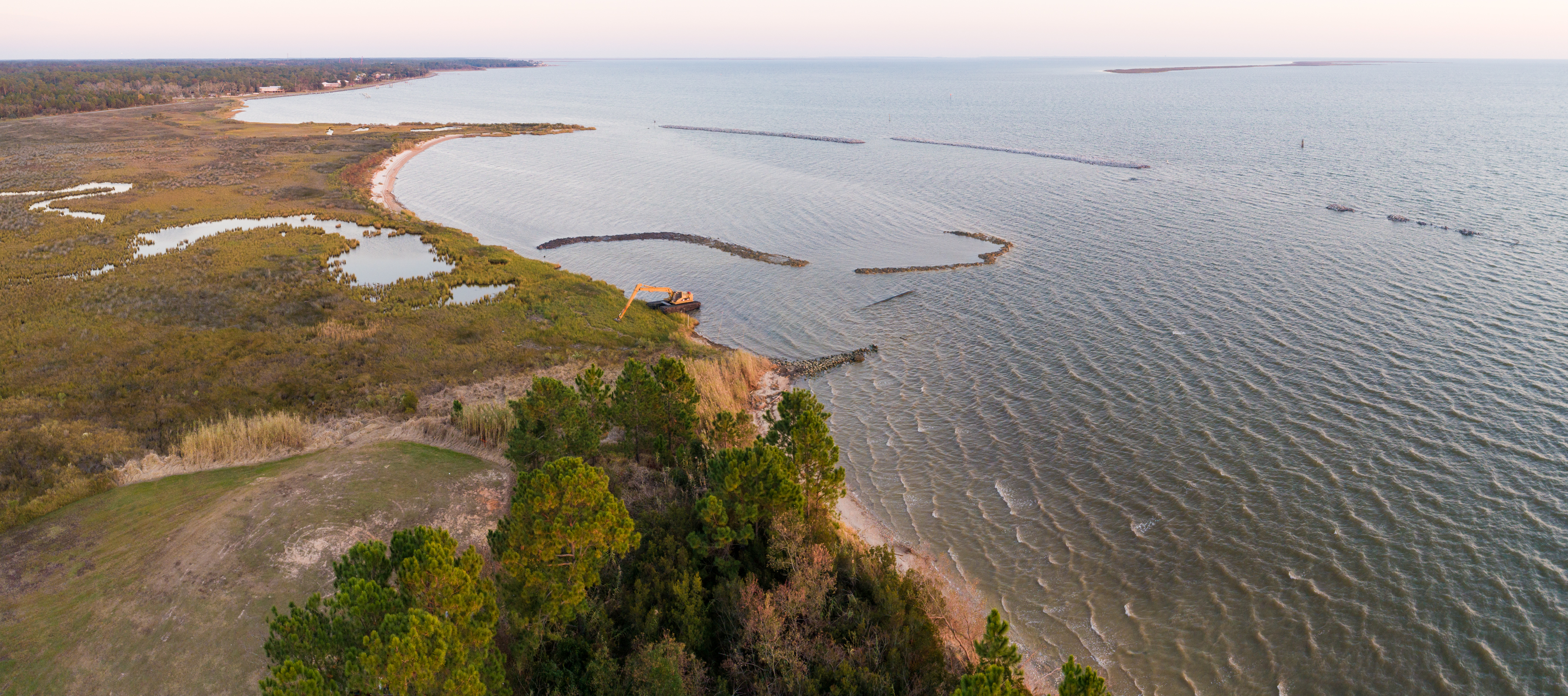 Water and land meet along a coastline.