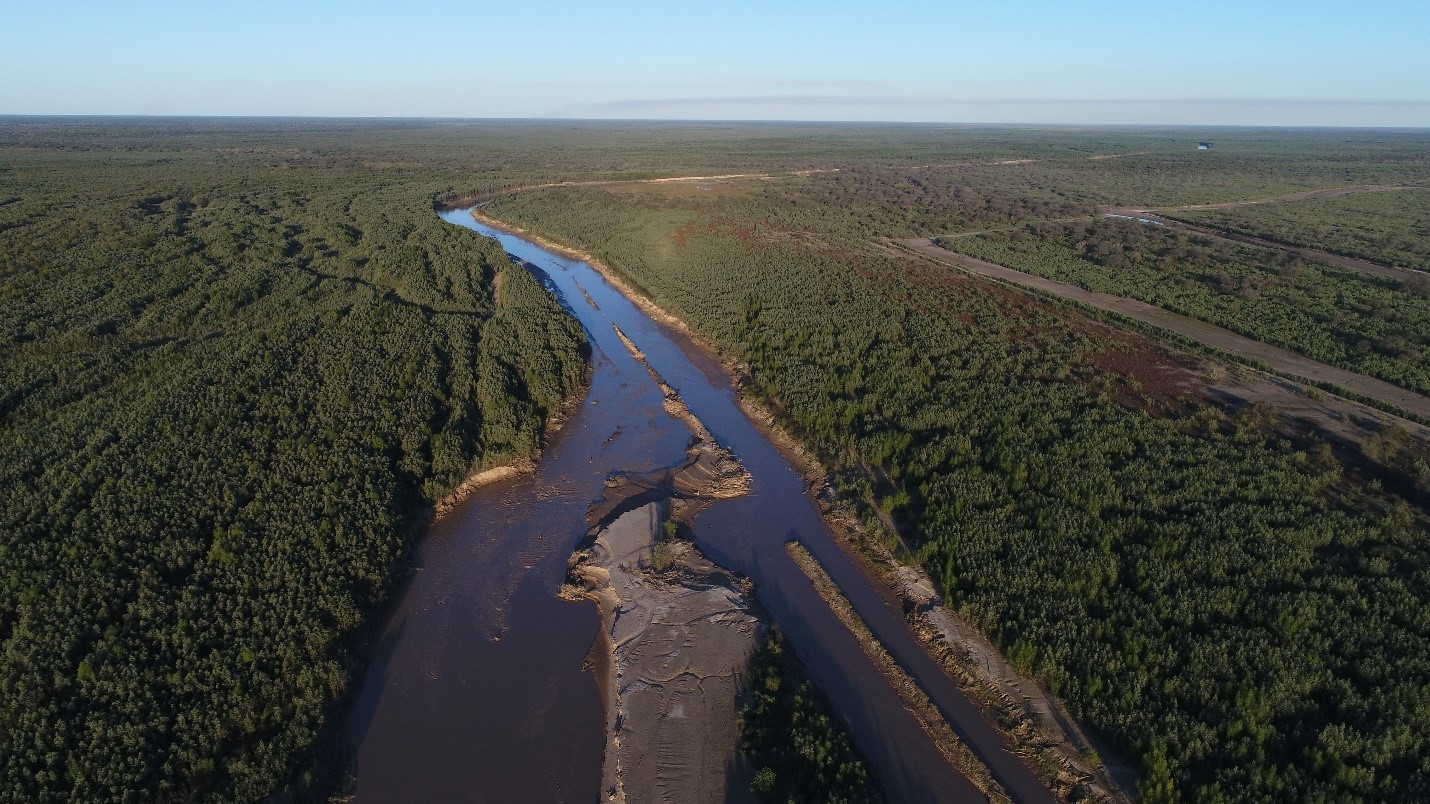 A sweeping view of a river flowing through the Gran Chaco landscape.