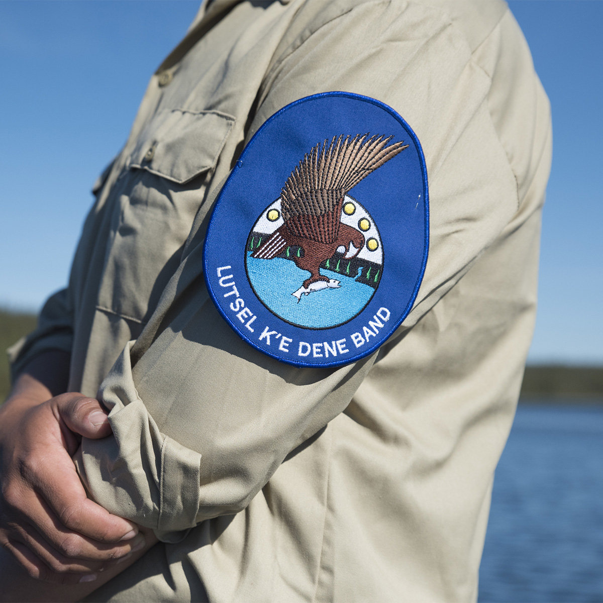 A close up of a ranger's arm with an eagle patch