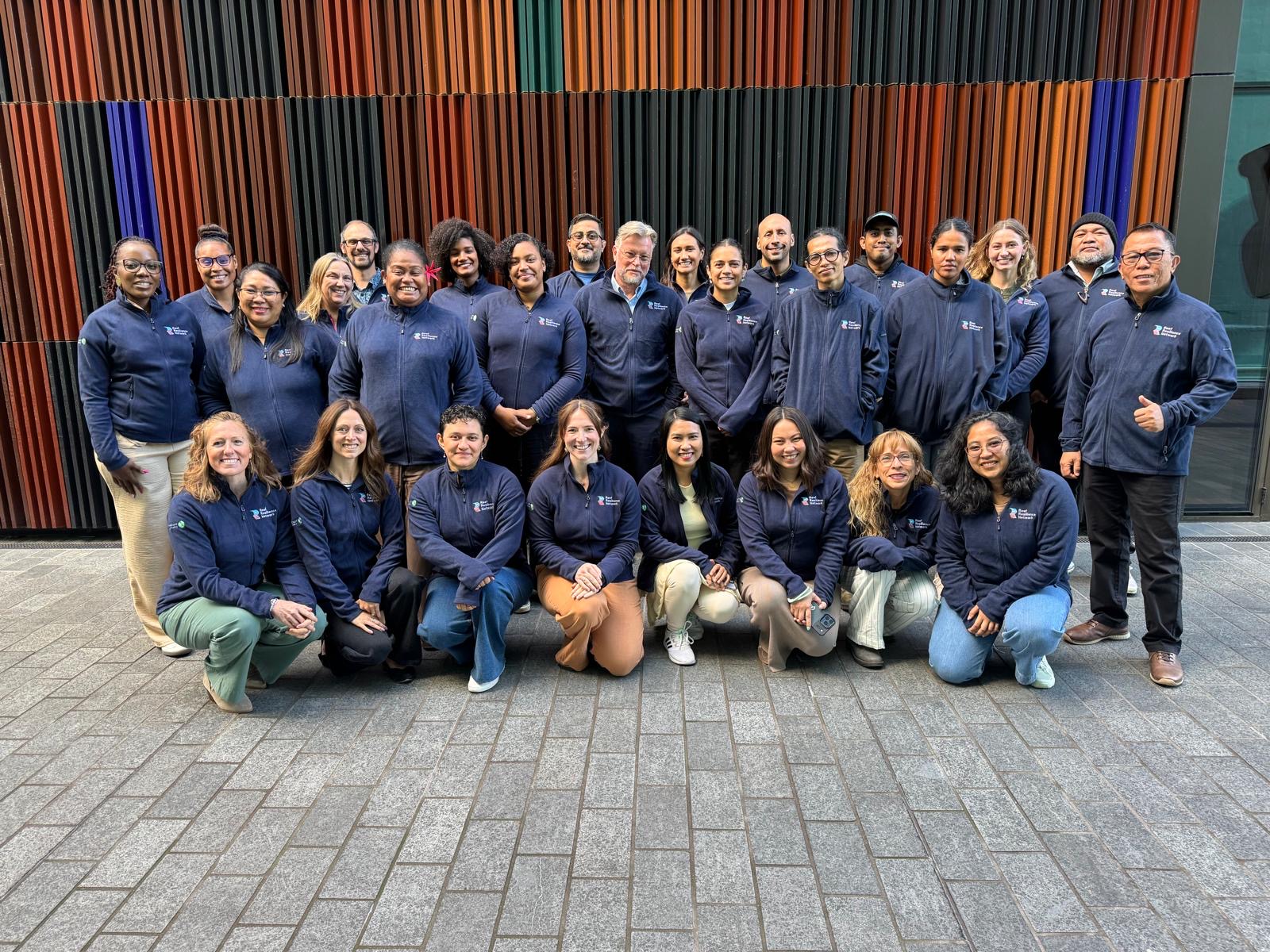 A group of coral reef managers get together for a photo at the International Coral Reef Symposium in New Zealand.