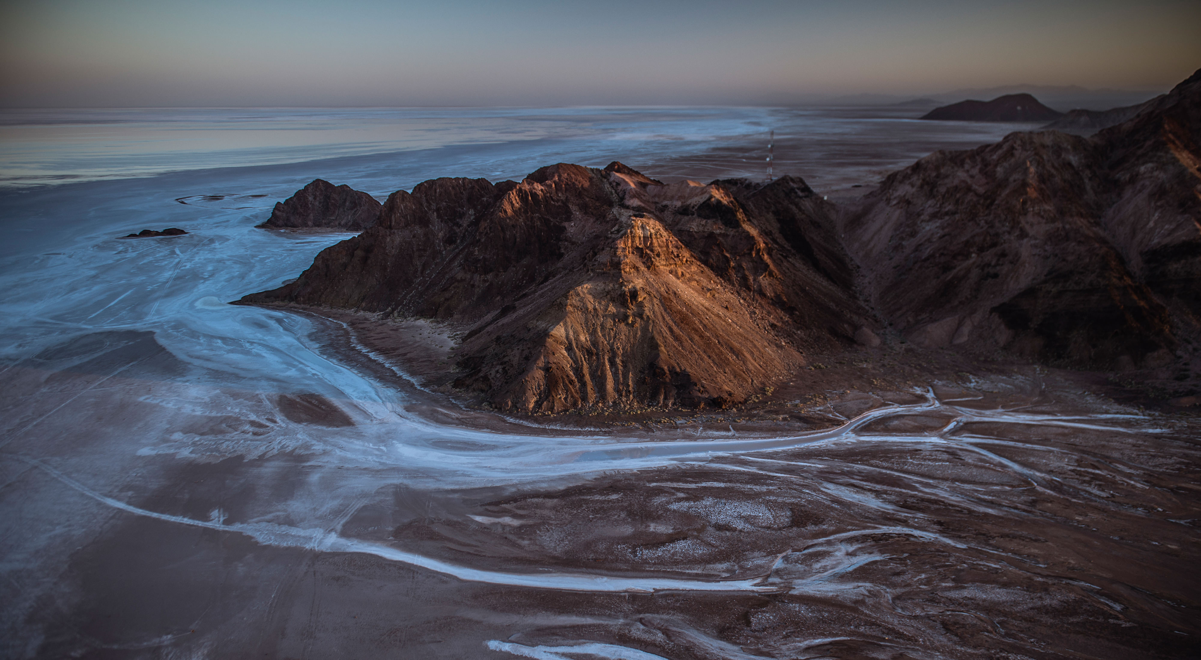 The Colorado River at its delta. The river breaks into multiple rivulets at it flows through mountains to the sea.