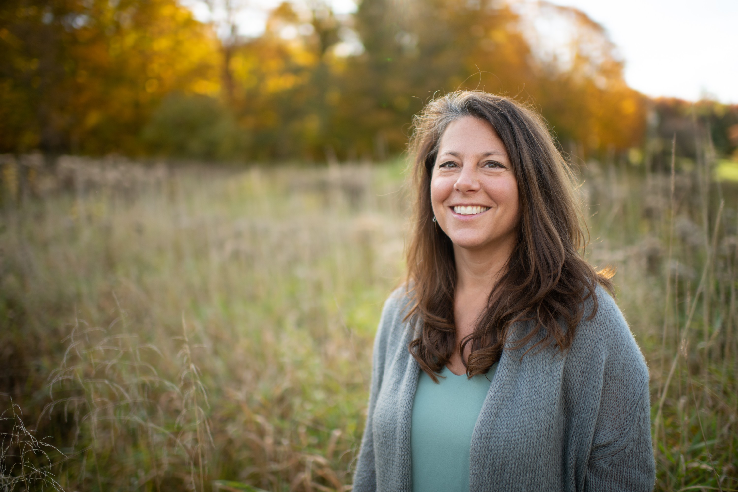 A picture of Heather in front of grassland. 